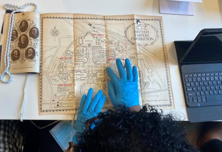 image of a person looking at an old map