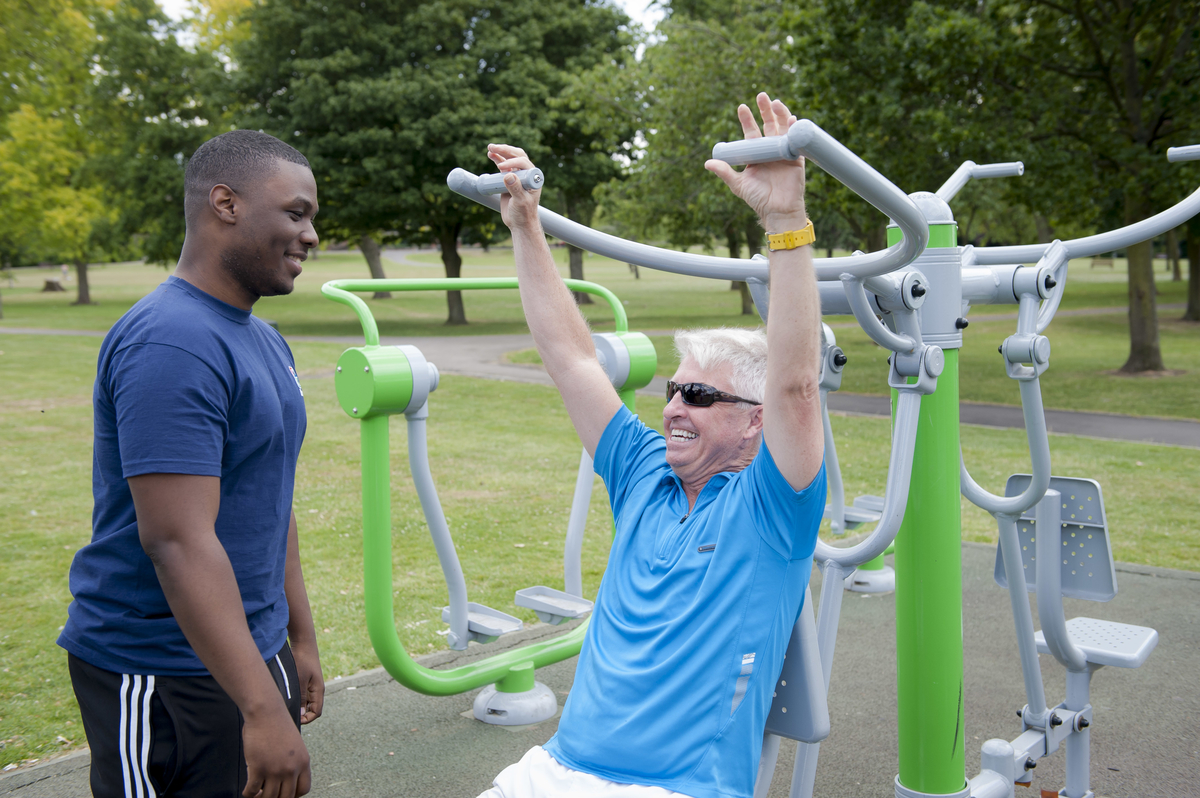 People using an outdoor gym in Brent