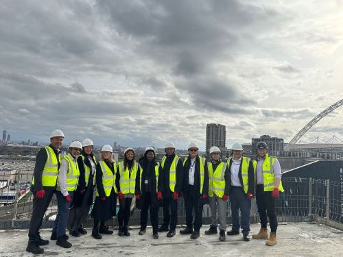 Construction workers and Brent members on Wembley Park roof
