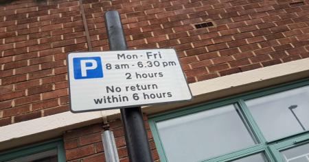 A controlled parking zone sign in a street