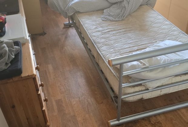 Image of a bed with heavy bedbug infestation