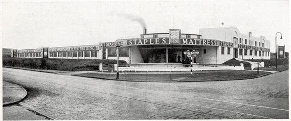 A black and white photo of the old Staples Mattress Co. building