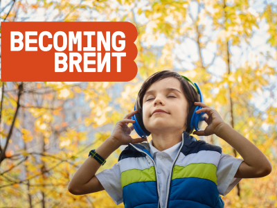 Boy with headphones on with red Becoming Brent logo