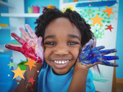 boy with painted hands and stars