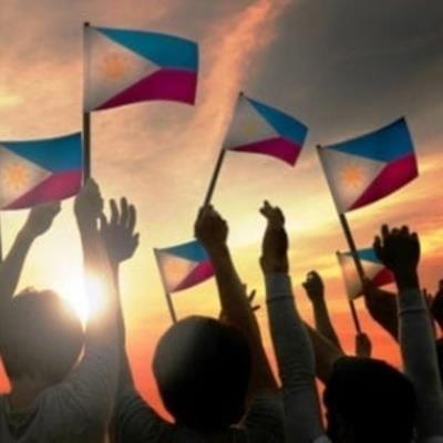 people waving philippine flags
