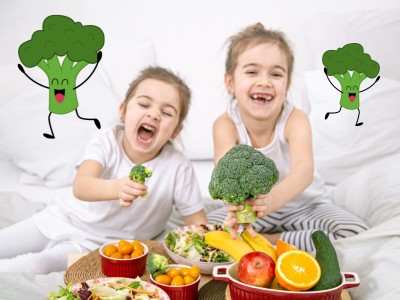 Two girl girls with fruit and veg and illustrated broccoli