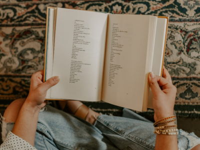 Hands hold an open book