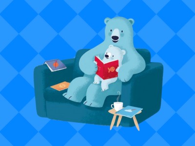 Bookstart bear and cub on blue sofa with blue background