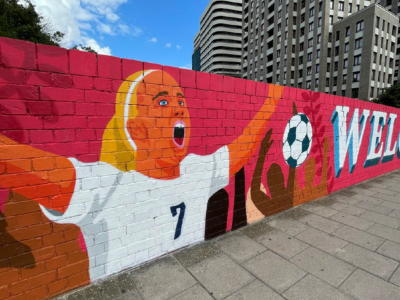 Football mural painted on a bridge
