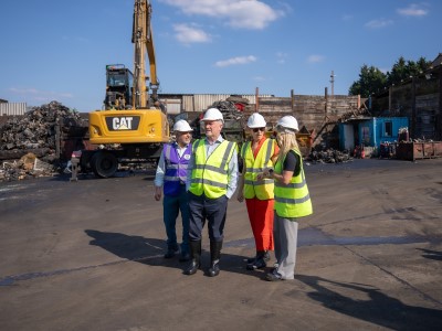 Cllr Butt, Steve Reed MP and Mary Creagh MP are taken around a scrap yard where a vehicle is about to be crushed