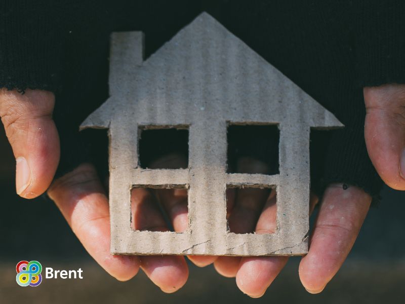 Cut out of a house in someone's hands