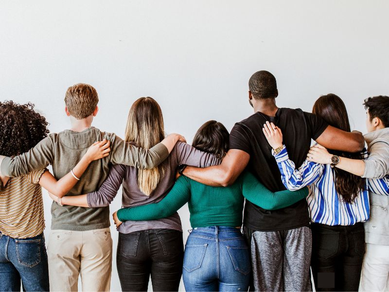 People standing shoulder to shoulder