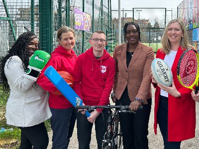 Photo of staff from Sport England and Brent Council on the grounds of the Jason Roberts Foundation