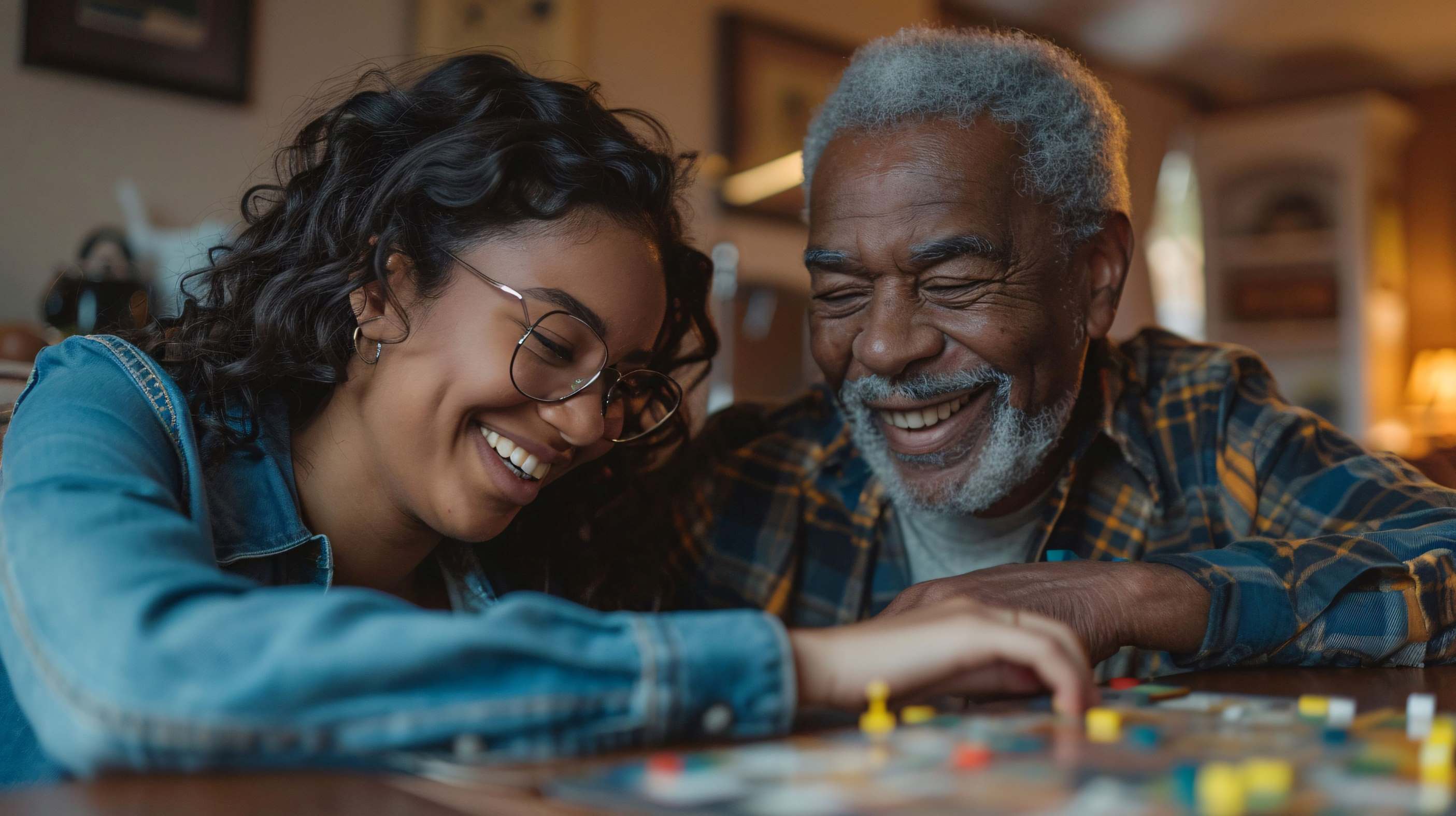 Older man playing a board game with young girl