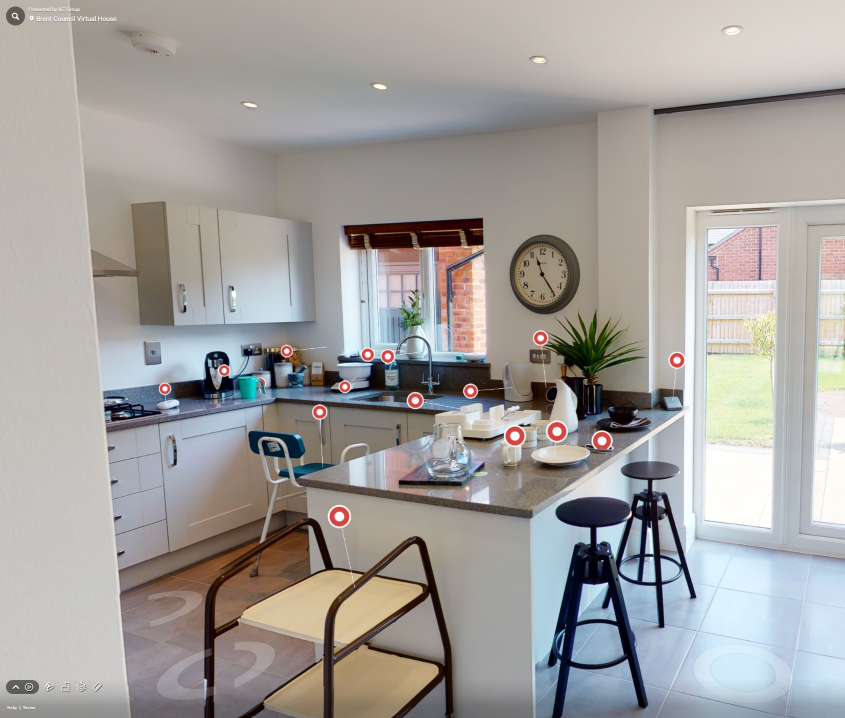 Photo of kitchen interior with a number of different assistive products in place