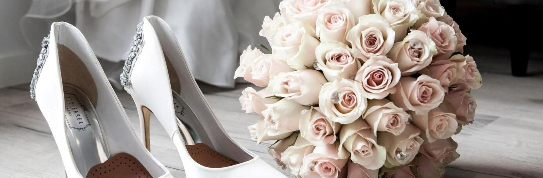 Image of wedding shoes and bouquet