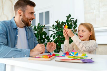 father and child doing crafts