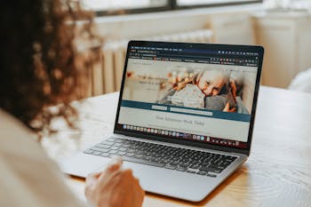 woman sitting in front of a laptop