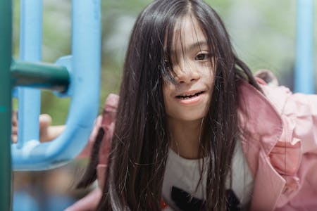 Girl playing on a swing