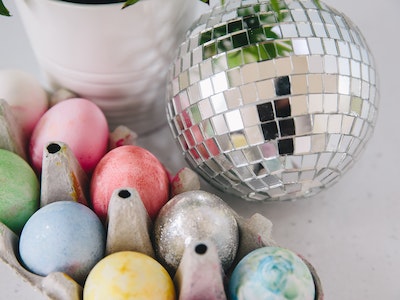 Easter eggs next to a silver disco ball