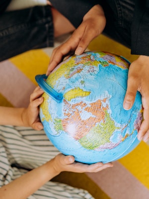 hands holding a globe