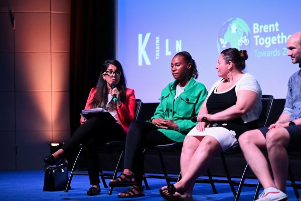 Nadia Khan hosts on stage with group for Kiln Take Over Day