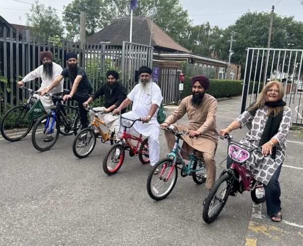 Willesden mosque group on repaired bikes