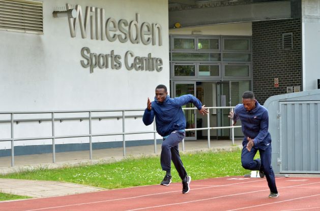 Two people running at Willesden Sports centre