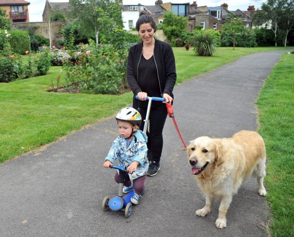 Woman walking with son and dog
