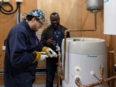 Student works on a boiler at the Green Skills Centre