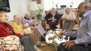 Group of elderly people in a nursing home sitting in a group