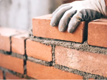 Image of a brick wall being built